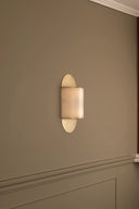Wall-mounted light fixture on a beige wall