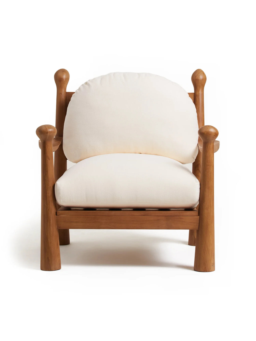 Heaps & Woods Pitufi Lounge Chair, a solid natural wood lounge chair featuring a chunky, sculptural frame with distinct rounded posts and armrests, topped with elegant finials. It boasts plush cream-colored fabric cushions for the seat and a rounded backrest, offering an organic modern aesthetic. Perfect as a rustic accent chair for a cozy living room or bedroom reading nook.