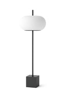 Modern floor lamp with white shade and black base on a white background