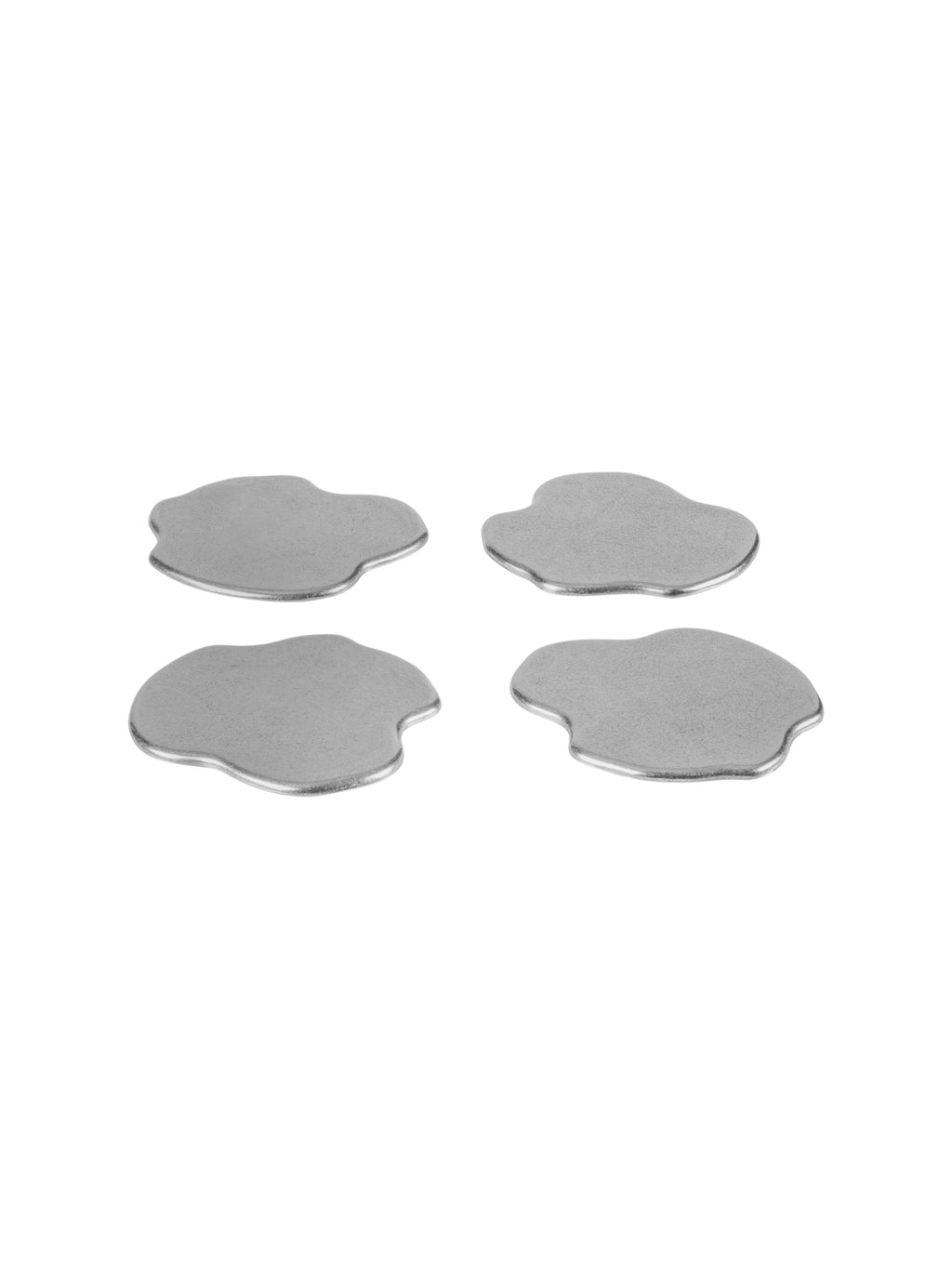 noo.ma Plama Stainless Steel Coaster - Set of 4, a collection of four modern minimalist drink coasters featuring a unique organic, irregular blob shape, crafted from durable matte silver stainless steel.