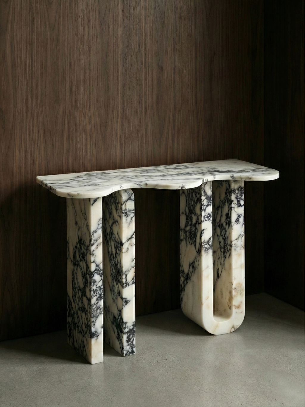 TCL Studios Pylon Marble Console, a sculptural brutalist console table crafted from premium white marble with striking dark grey and black natural veining.