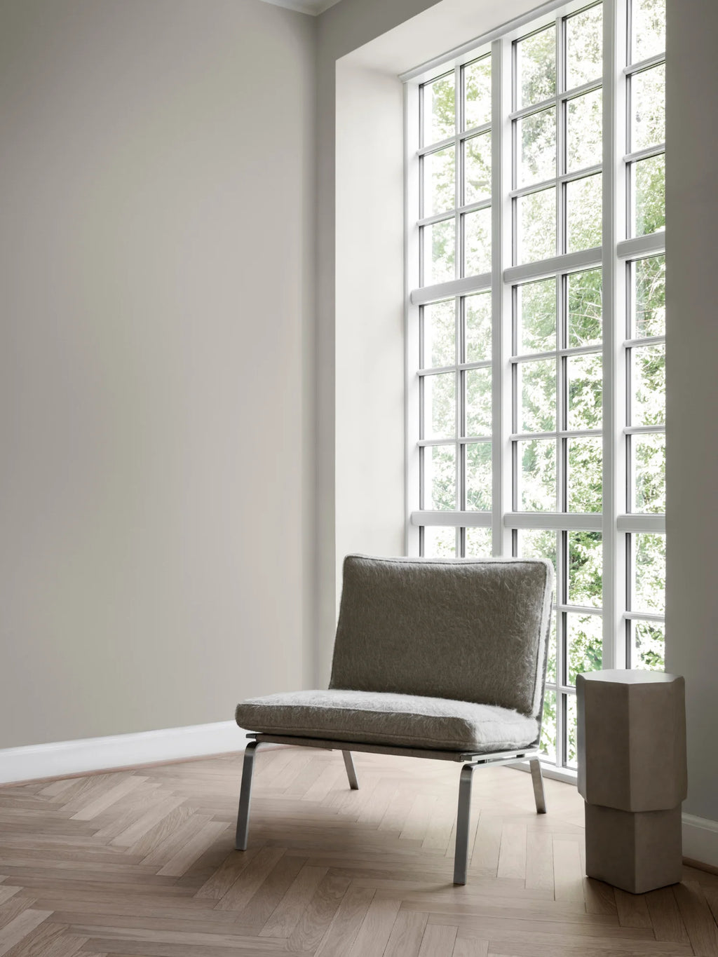 NORR11 Quartz Side Table, a modern, geometric side table with a unique stacked block design and a textured, stony taupe finish. This elegant and durable piece adds a stylish, sculptural element to any contemporary living space, perfect for design-conscious individuals.