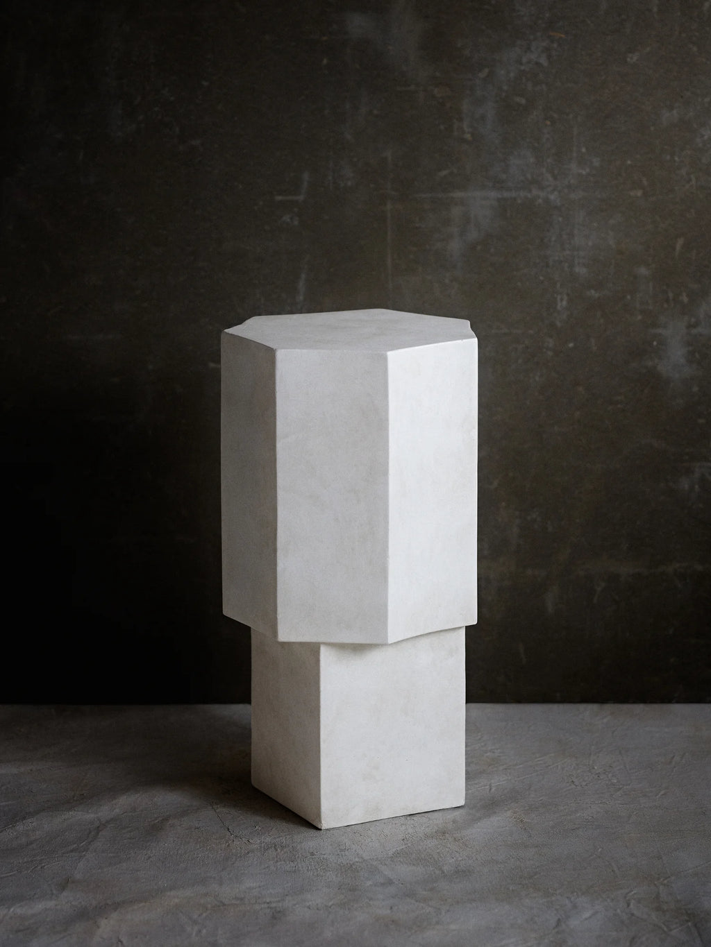 NORR11 Quartz Side Table, a modern, geometric side table with a textured white finish and clean lines. This elegant piece offers a durable and stylish addition to contemporary living spaces.