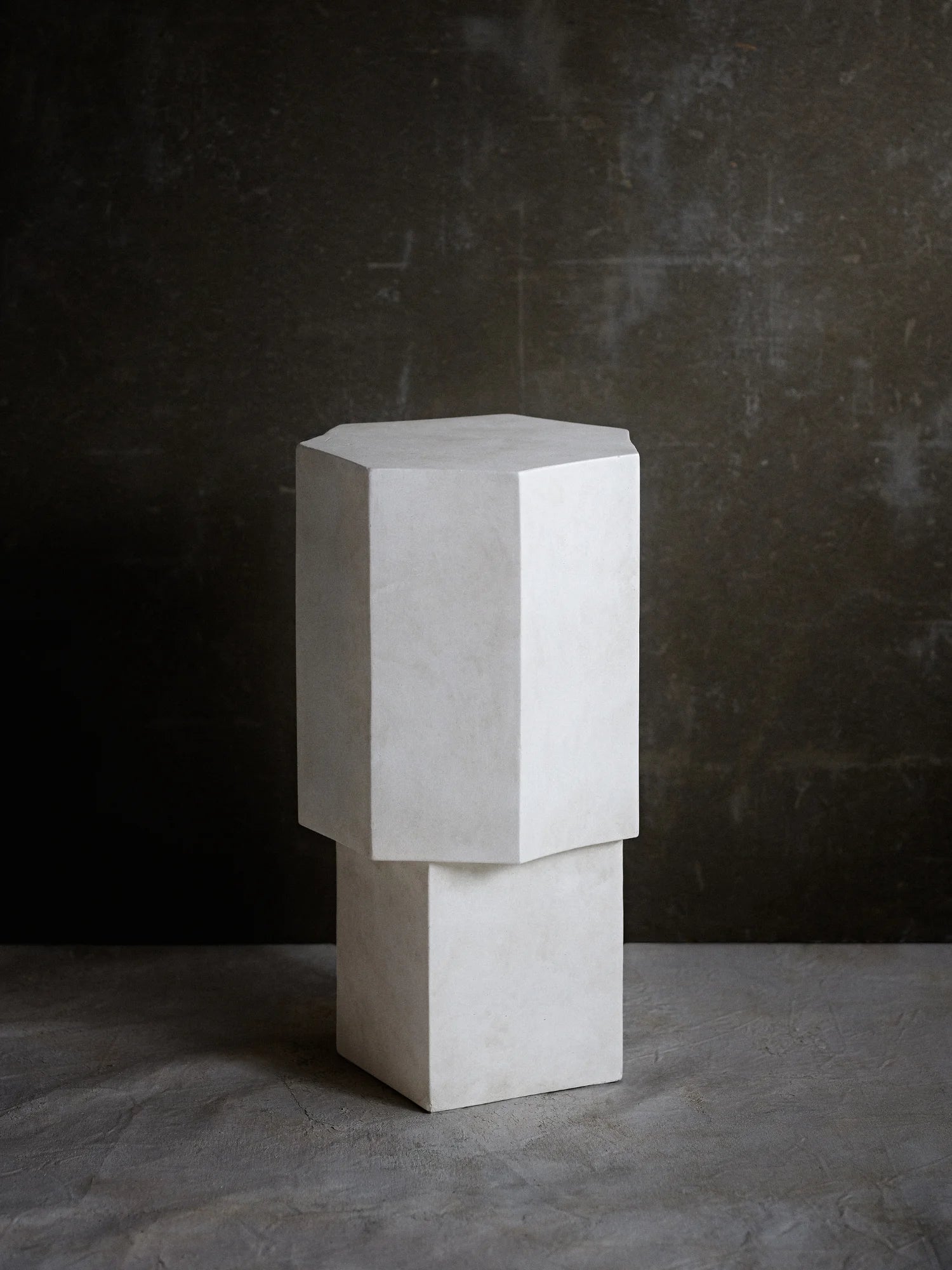 NORR11 Quartz Side Table, a modern, geometric side table with a textured white finish and clean lines. This elegant piece offers a durable and stylish addition to contemporary living spaces.