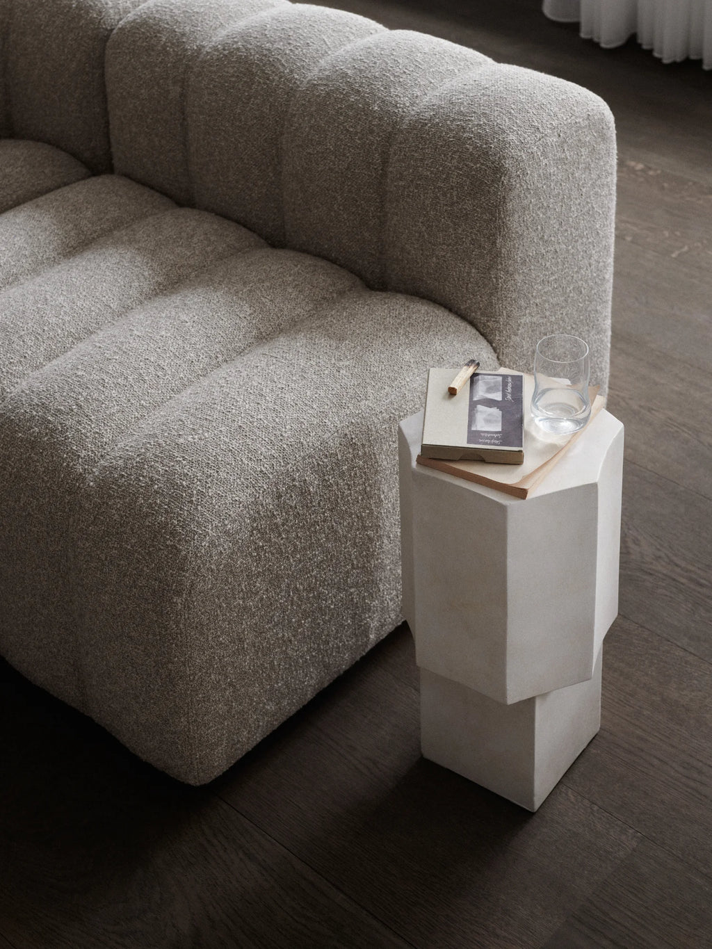 NORR11 Quartz Side Table, a modern geometric side table in a pale, matte neutral tone with clean, sculptural lines. Perfect for adding a stylish and durable accent piece to a contemporary living space.