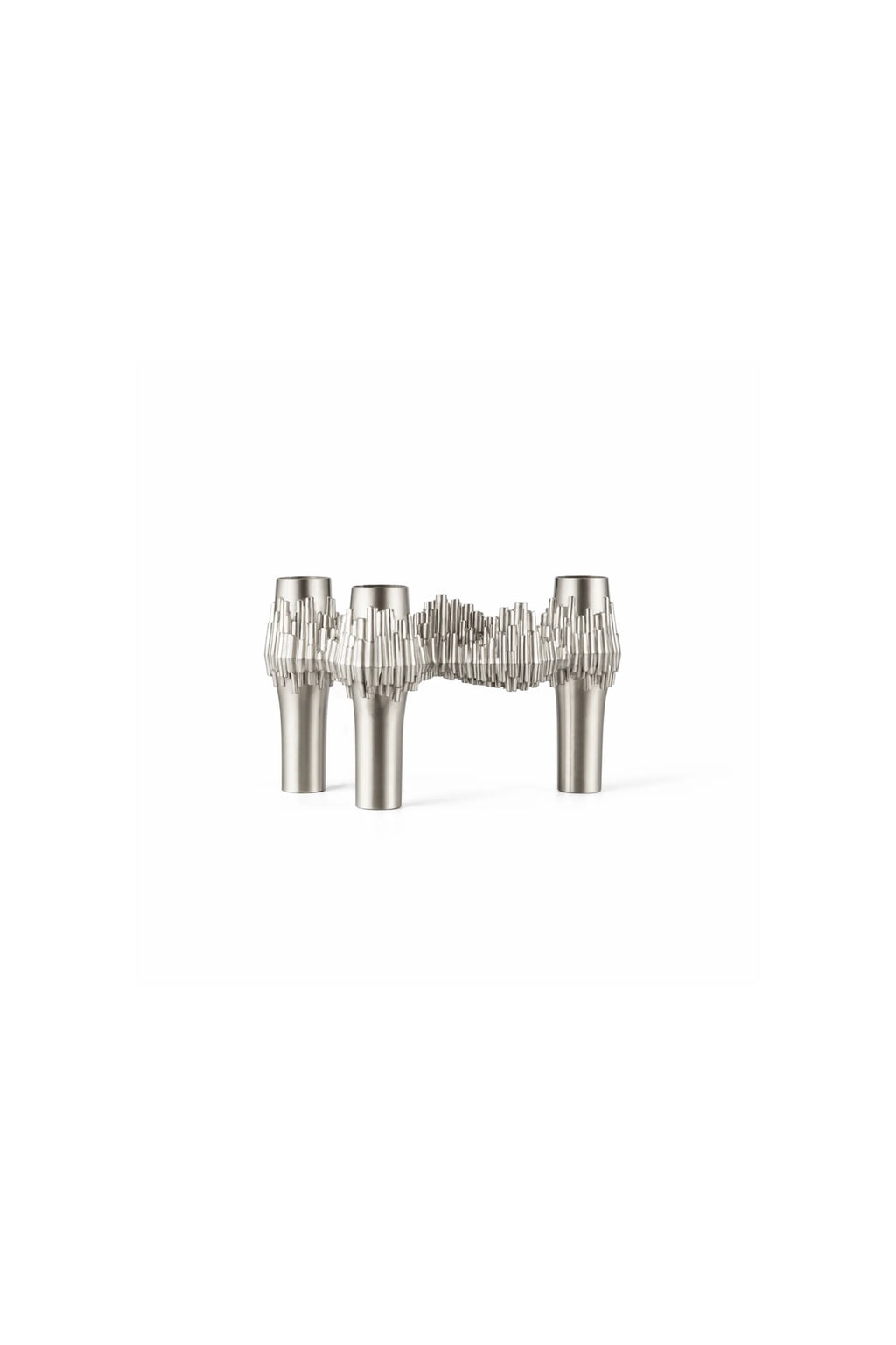 Stoff Nagel Quist Candle Holder, a brushed silver modular candelabra featuring a sculptural, brutalist design with intricate spiky, textured ridges along its metallic surface and three distinct candle openings. This iconic mid-century modern decorative object makes a striking dining table centerpiece or statement decor for contemporary living rooms.