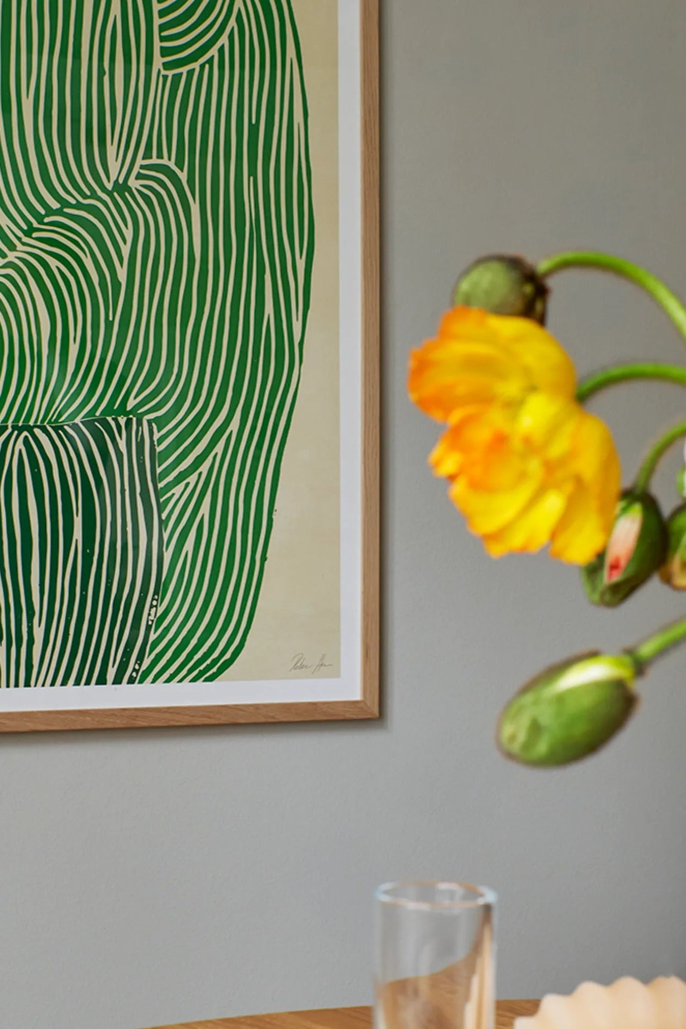 Close-up of a refreshing Green Ocean drink in a glass with ice cubes and mint leaves on a wooden table