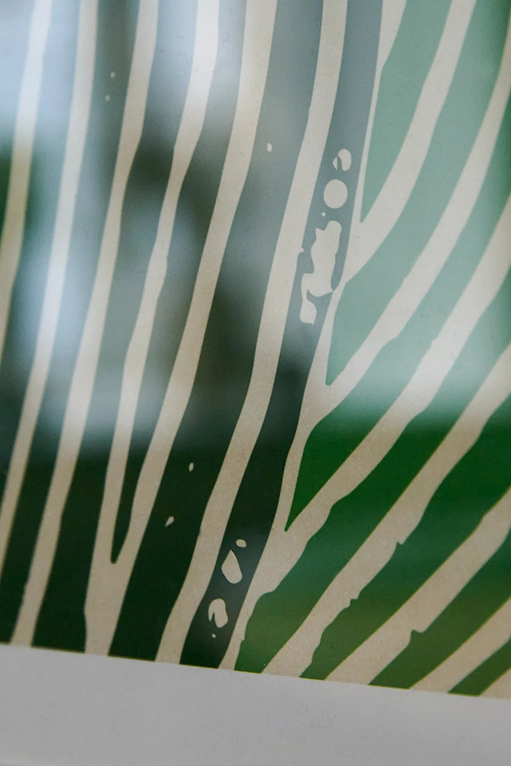  A woman holding a bottle of Green Ocean smoothie with tropical fruits and green vegetables
