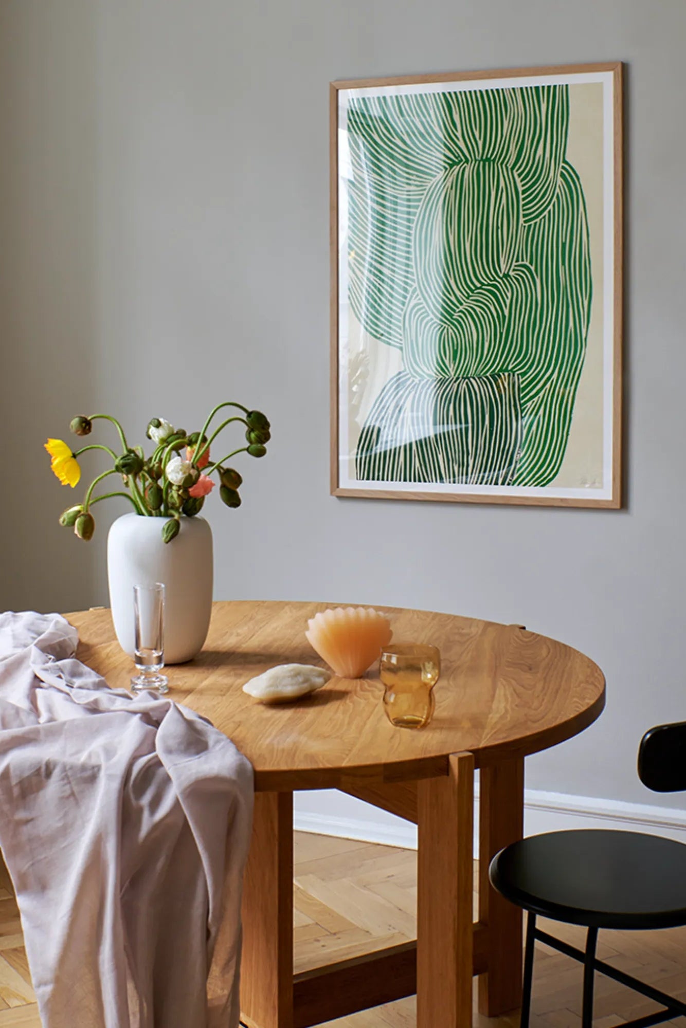 Aerial view of a vibrant Green Ocean juice in a mason jar with a straw and slices of kiwi and cucumber