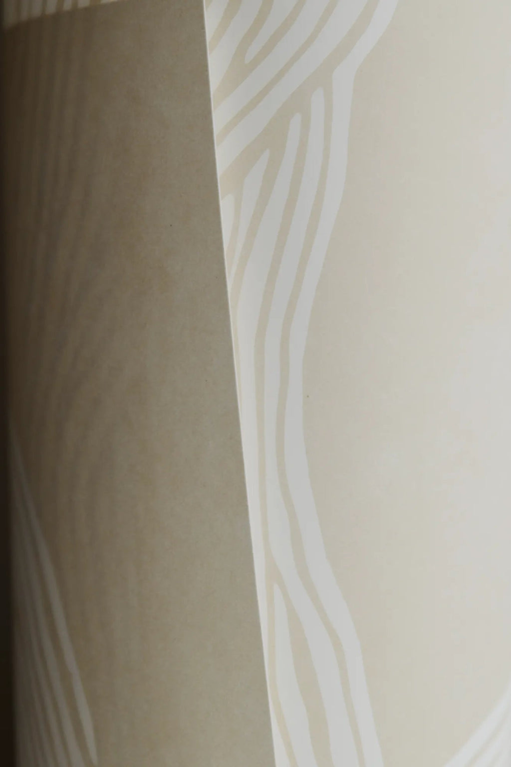 The Poster Club The Line no. 07, an abstract art print featuring organic, hand-drawn cream lines against a soft beige background, creating a subtle, flowing pattern.