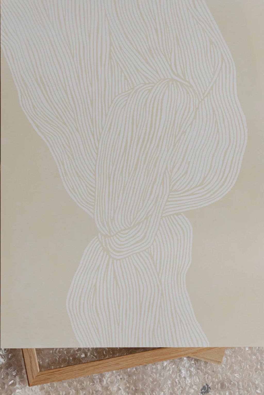 The Poster Club The Line no. 07, an abstract art print featuring organic, flowing off-white lines that intricately intertwine against a warm beige background.
