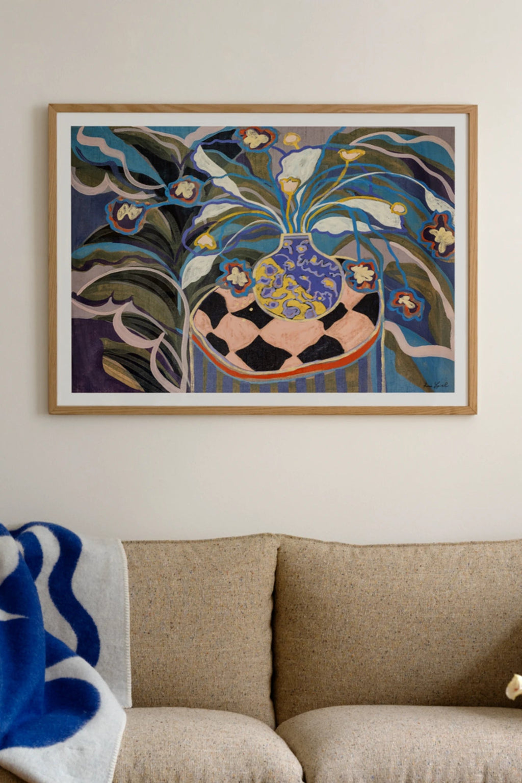 The Poster Club Giorgia, a vibrant abstract floral art print featuring a stylized vase of flowers with bold, flowing shapes and a rich, earthy color palette including deep blues, greens, purples, yellow, and soft pinks. This contemporary wall art is presented in a light natural oak frame with a clean white mat, ideal for modern living rooms, bedrooms, or creating a colorful gallery wall statement.