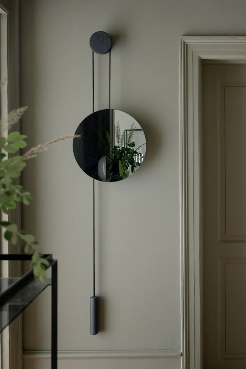 Close up of the sleek frame and beveled edges of Rise & Shine Wall Mirror