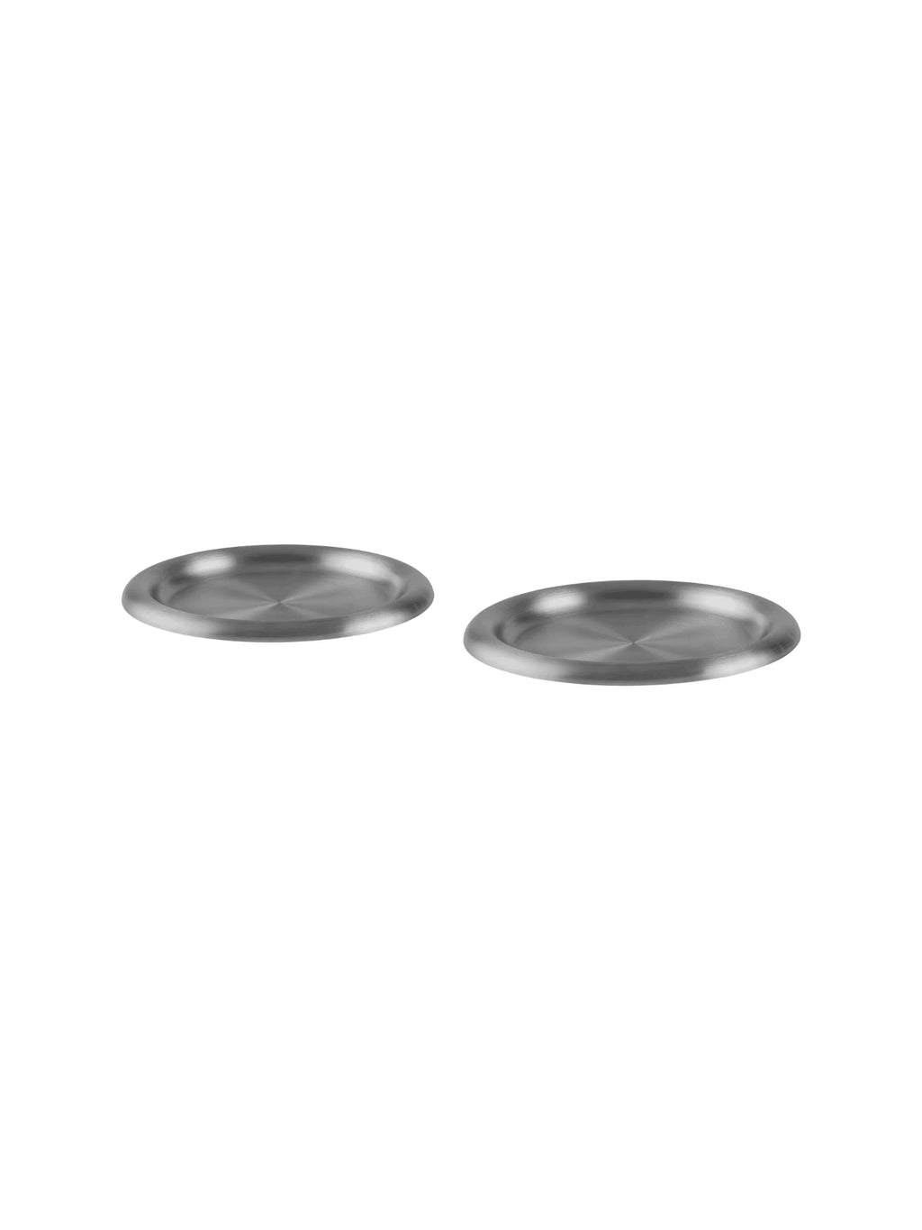 Two metallic plates on a white background