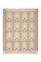 Patterned rug with decorative design on a plain background