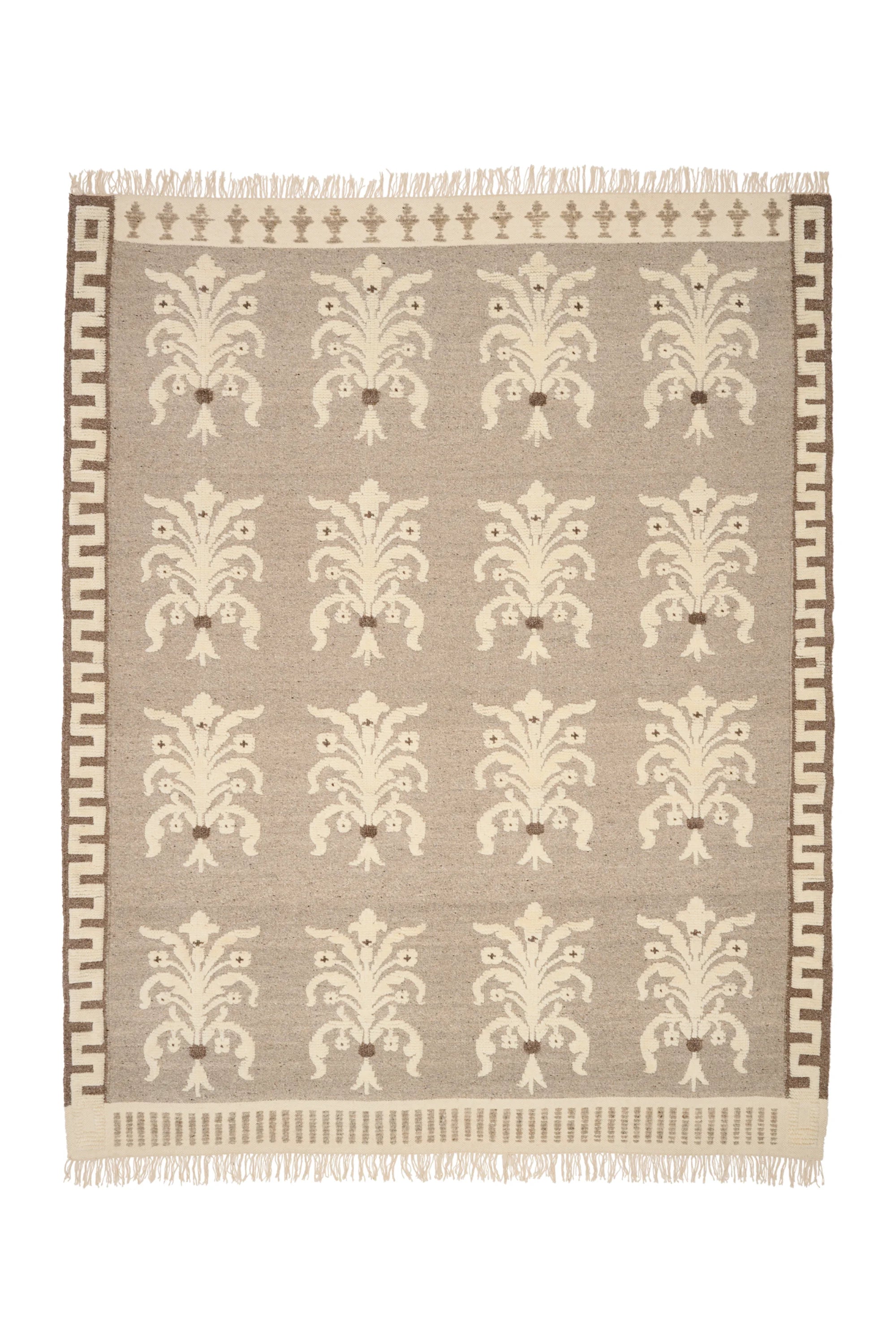 Patterned rug with decorative design on a plain background