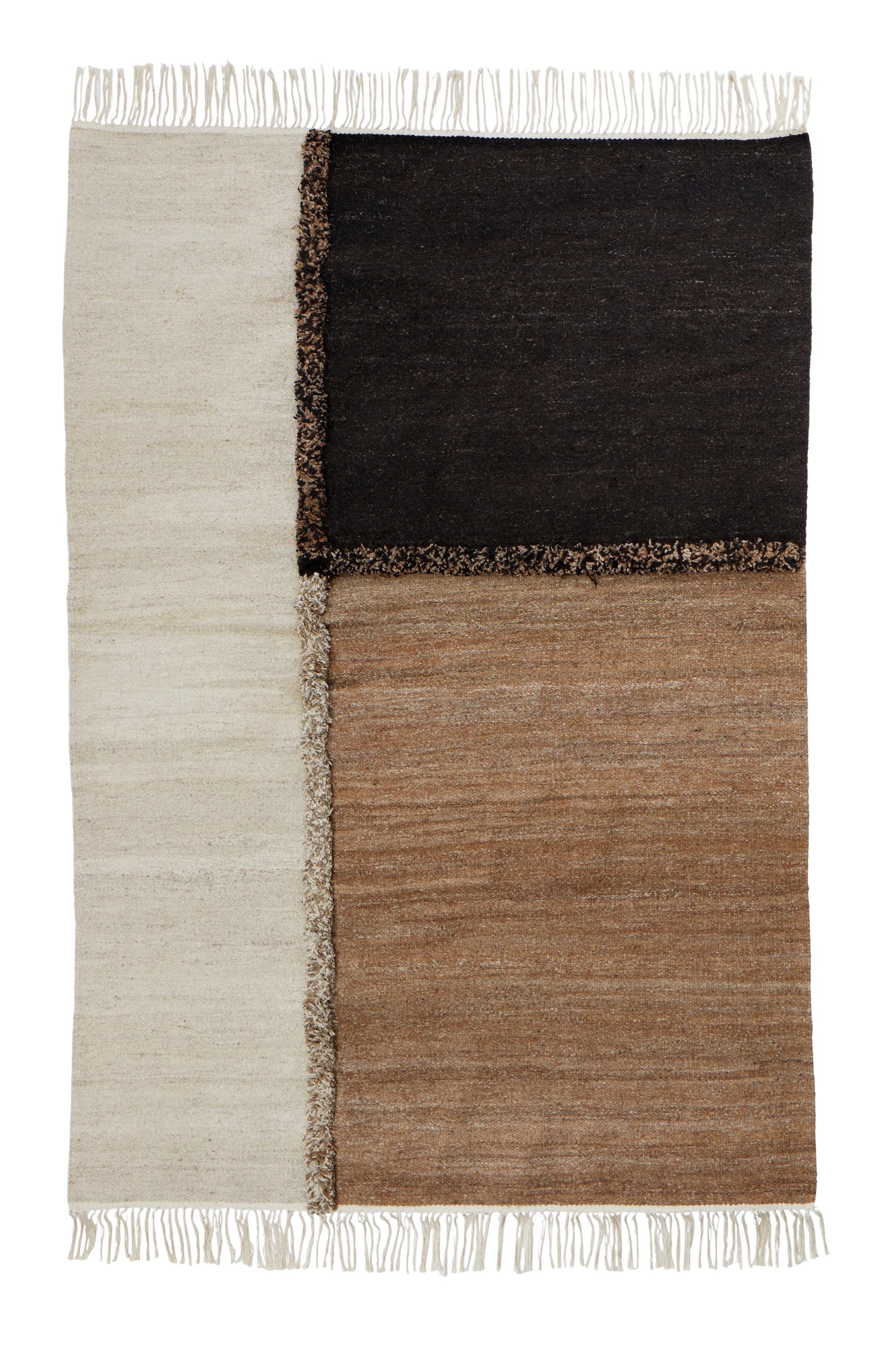 Sera Helsinki E-1027 Wool Rug, a hand-knotted wool area rug featuring a striking geometric block pattern in natural cream, deep dark brown, and warm camel brown tones.