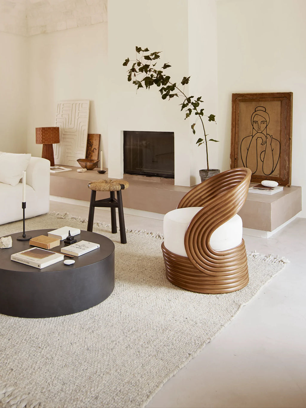 Tine K Sand Wool Rug, a hand-woven natural wool area rug featuring a soft, flecked sand and light grey texture with a subtle fringe detail, offering a cozy, organic modern aesthetic. This versatile floor covering is perfect for Scandinavian living rooms, minimalist bedrooms, or coastal-inspired spaces seeking a neutral and inviting foundation.