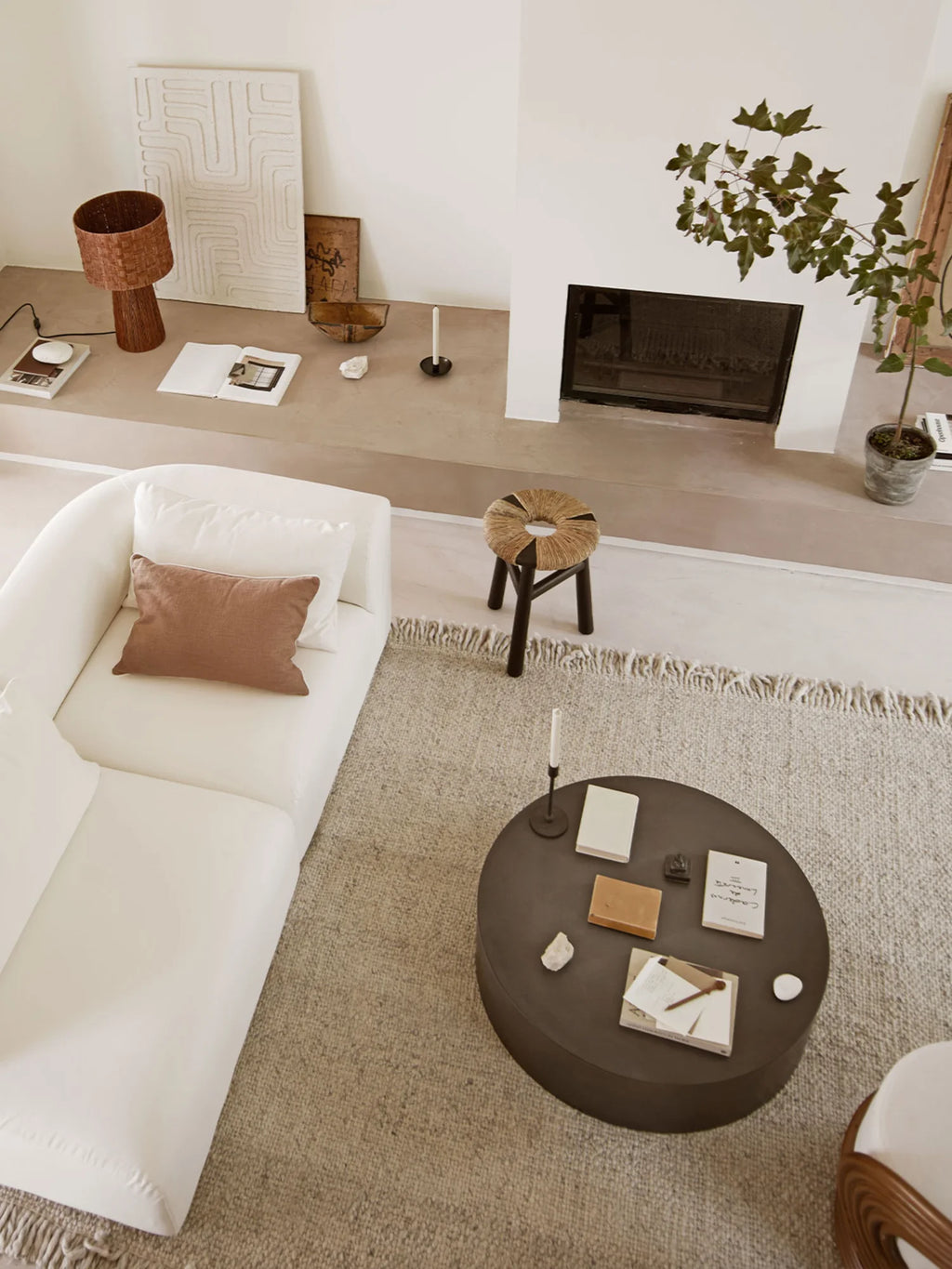 Tine K Sand Wool Rug, a hand-knotted natural wool area rug in warm sand and beige tones with a plush, textured weave and decorative fringe detailing. This organic modern rug offers a cozy, minimalist foundation for Scandinavian living rooms, coastal bedrooms, or inviting hygge-inspired spaces.
