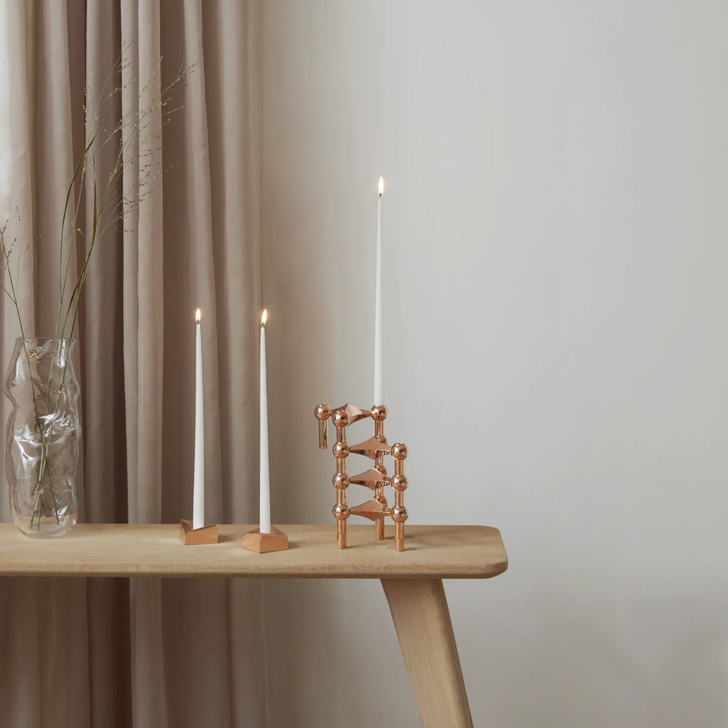 Sleek and stylish candle holder with modular configuration in rose gold