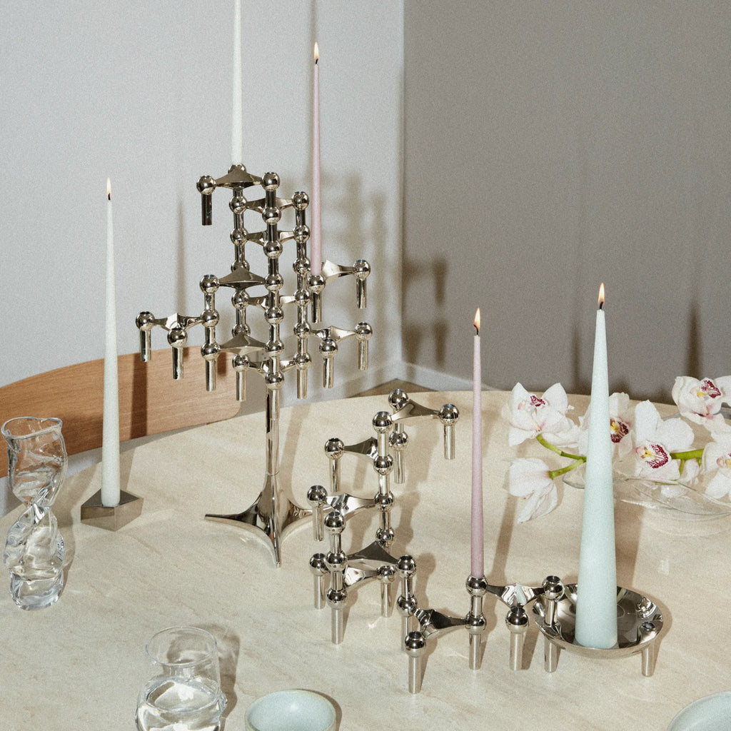 Stoff Nagel Candle Holder Stand, an iconic mid-century modern modular candle holder crafted from polished chrome metal, featuring a stackable, sculptural design with geometric three-pronged arms and spherical joints.