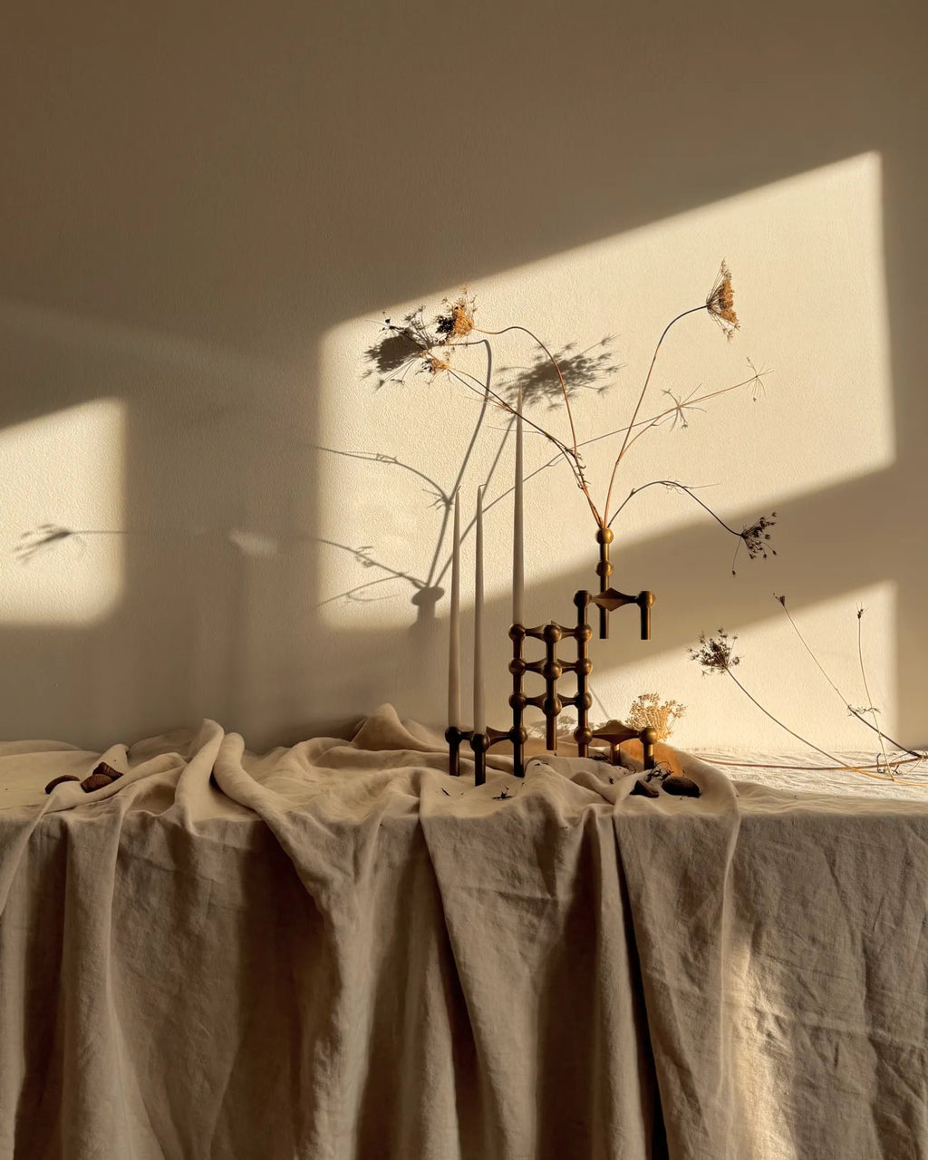 Three-tiered candle holder in bronzed brass with interlocking modules