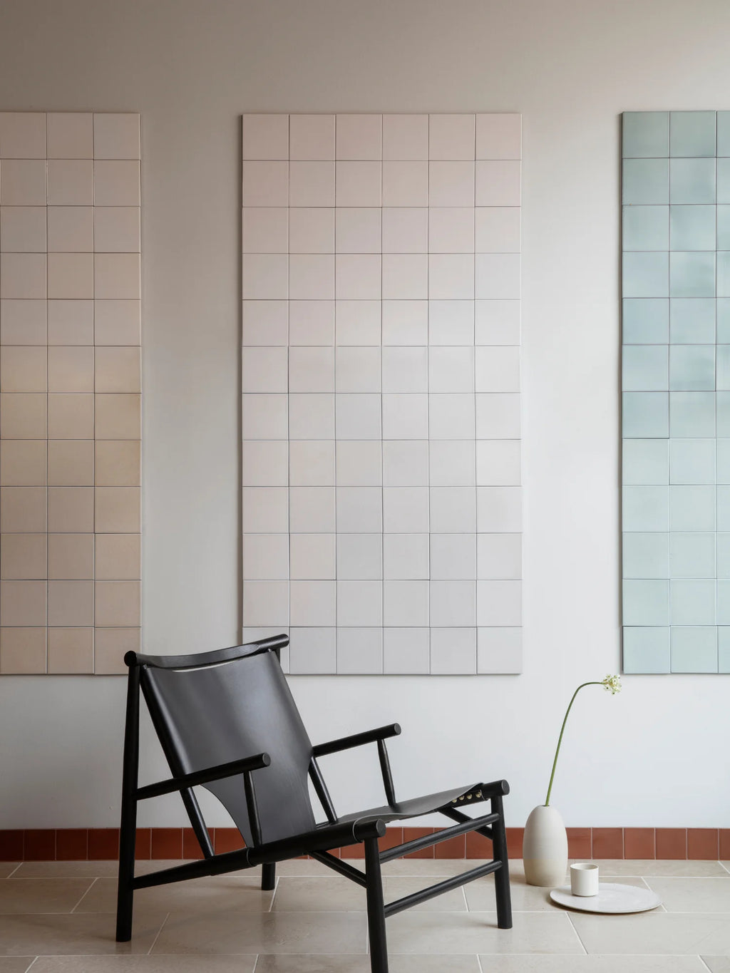 NORR11 Samurai Chair, a modern, elegant lounge chair featuring a durable black leather seat and a premium black wood frame. This stylish chair is perfect for any discerning individual seeking sophisticated comfort.