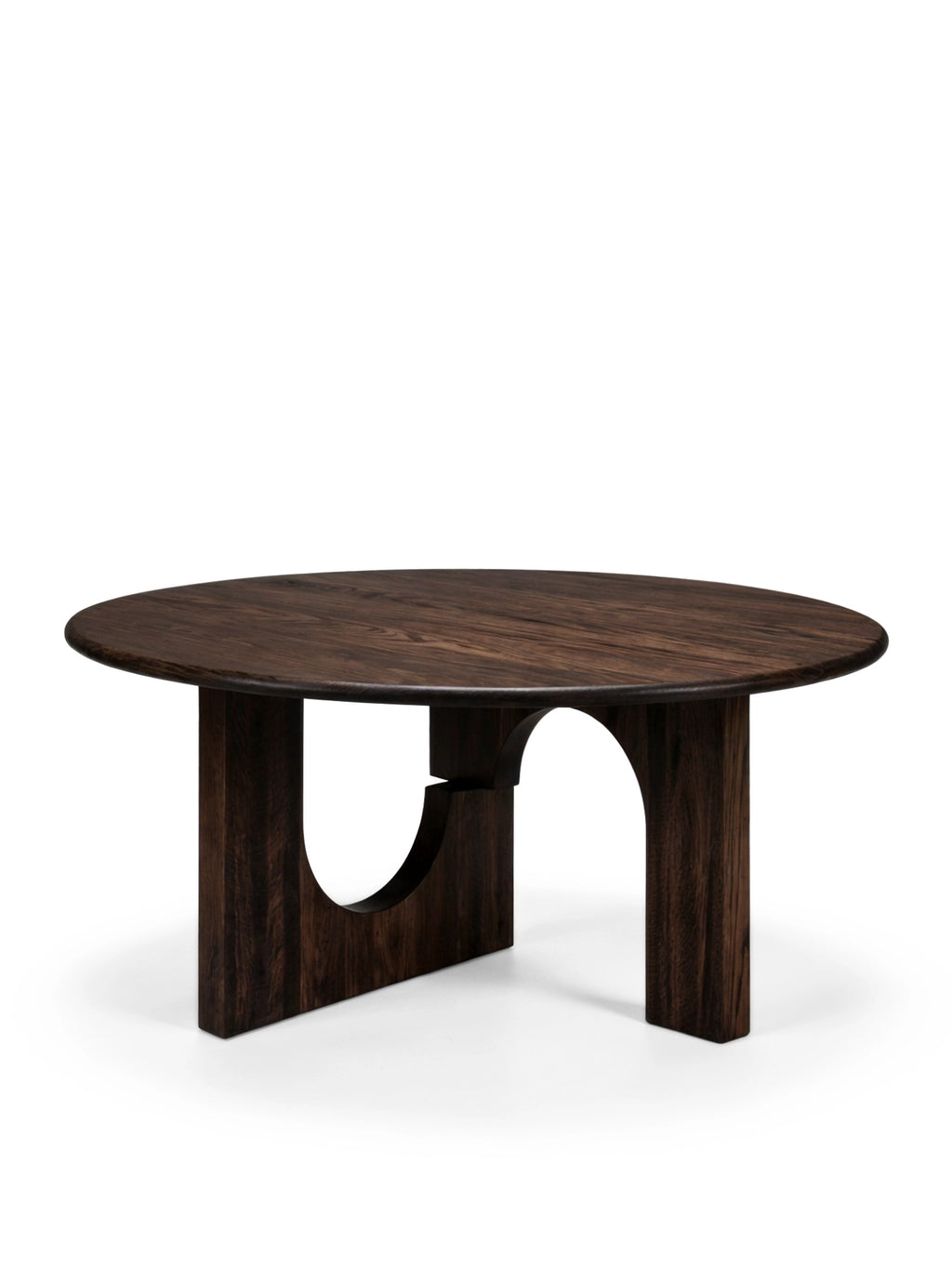 Tinted Objects Sanders Round Dining Table, featuring a dark espresso-stained wood finish with visible grain on its round top and two arched, modern pedestal legs. This stylish wooden dining table is perfect for contemporary homes seeking a unique, durable centerpiece for entertaining.