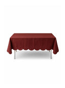 Red tablecloth on a rectangular table with a white background