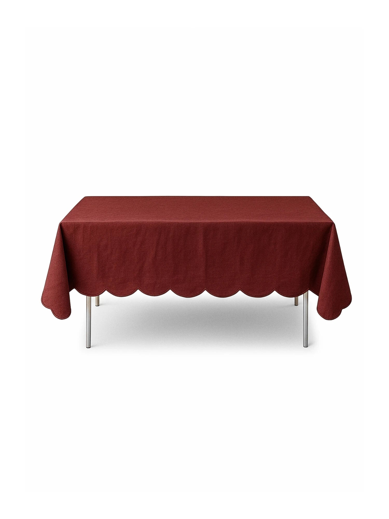 Red tablecloth on a rectangular table with a white background