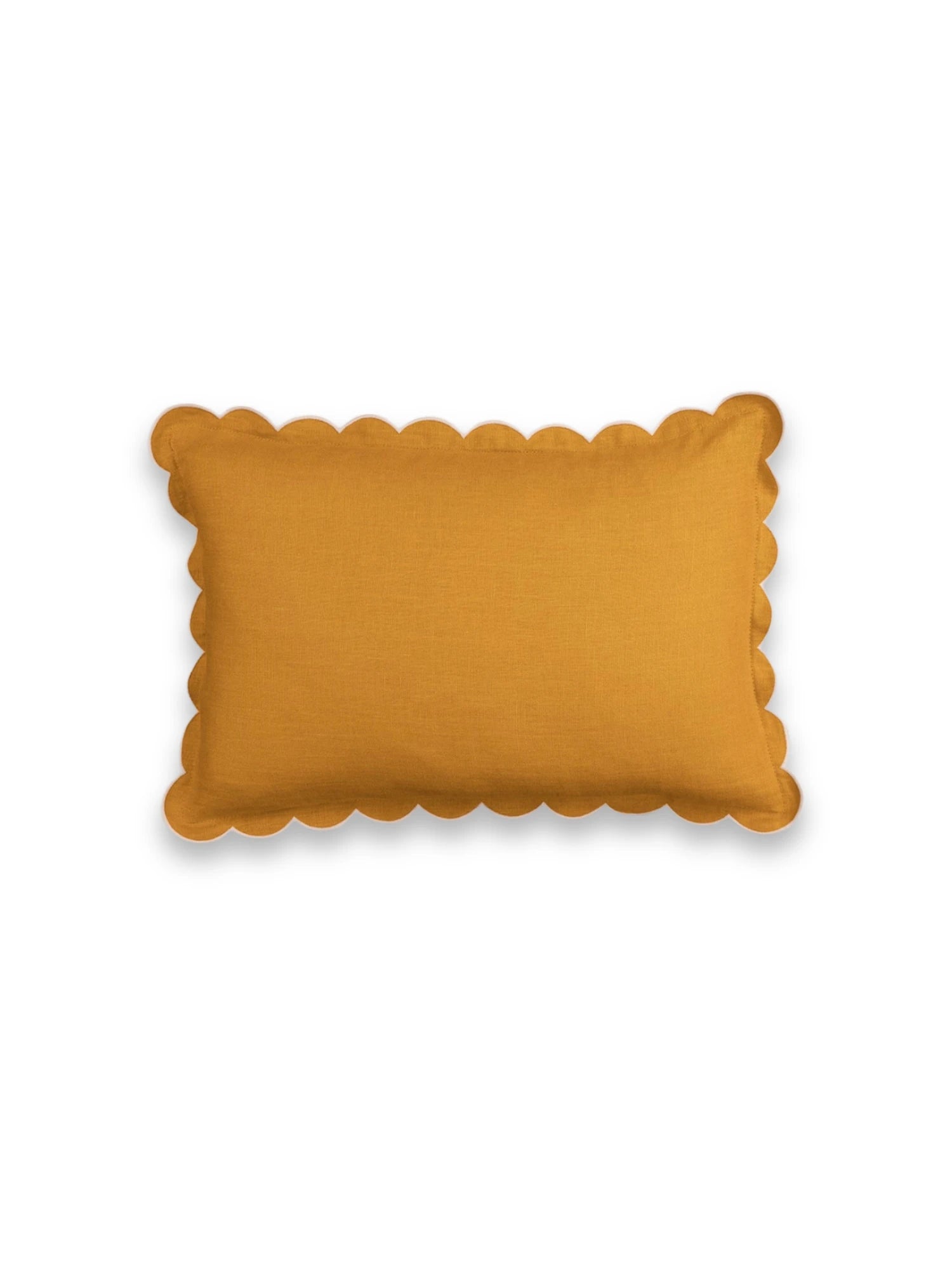 Yellow cushion with scalloped edge on a white background
