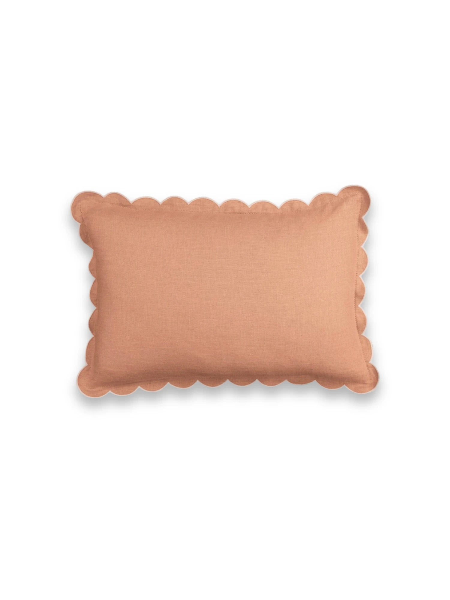 Rectangular cushion with scalloped edge in terracotta color on a white background