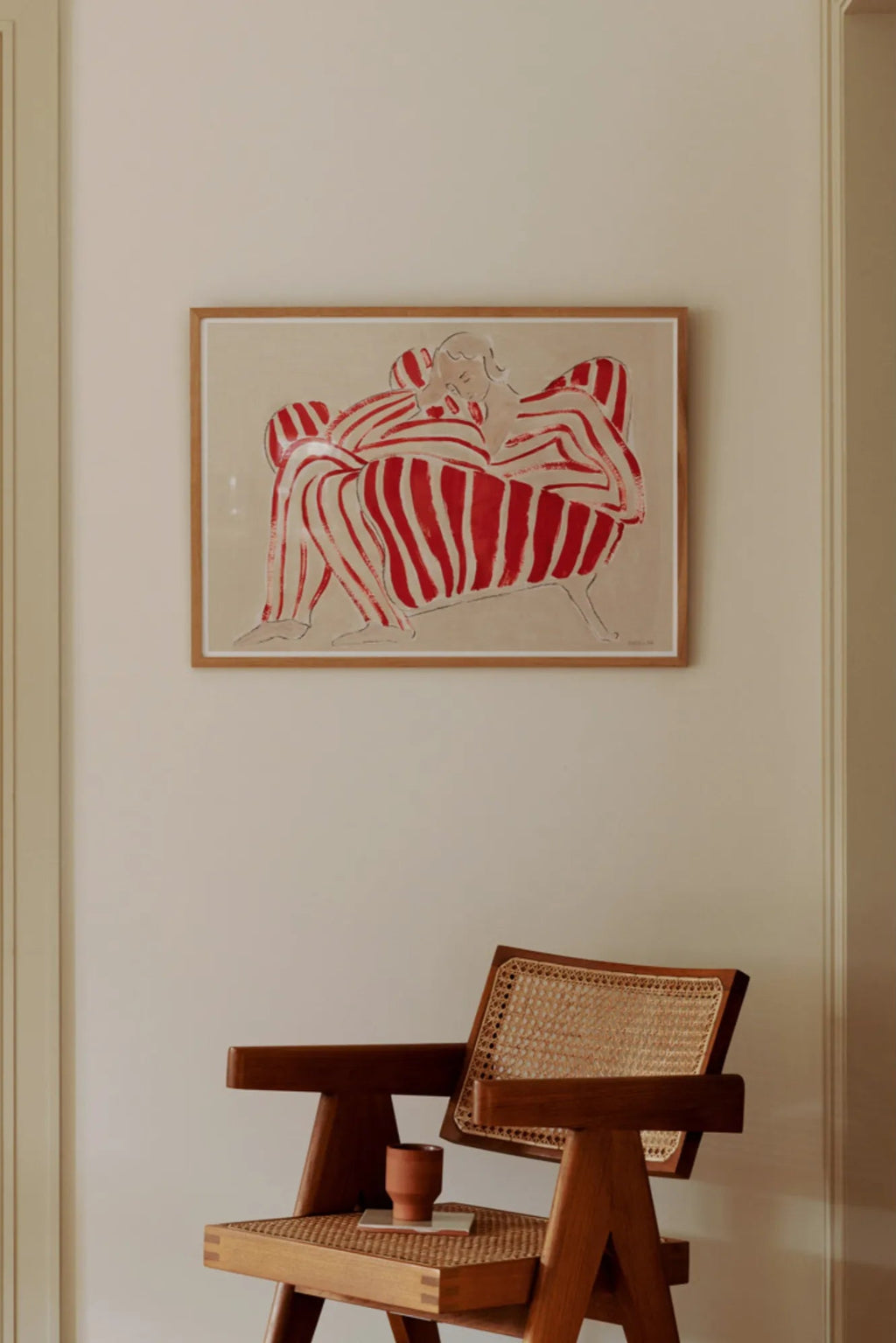  Red chair in a living room setting, adding a pop of color to the space