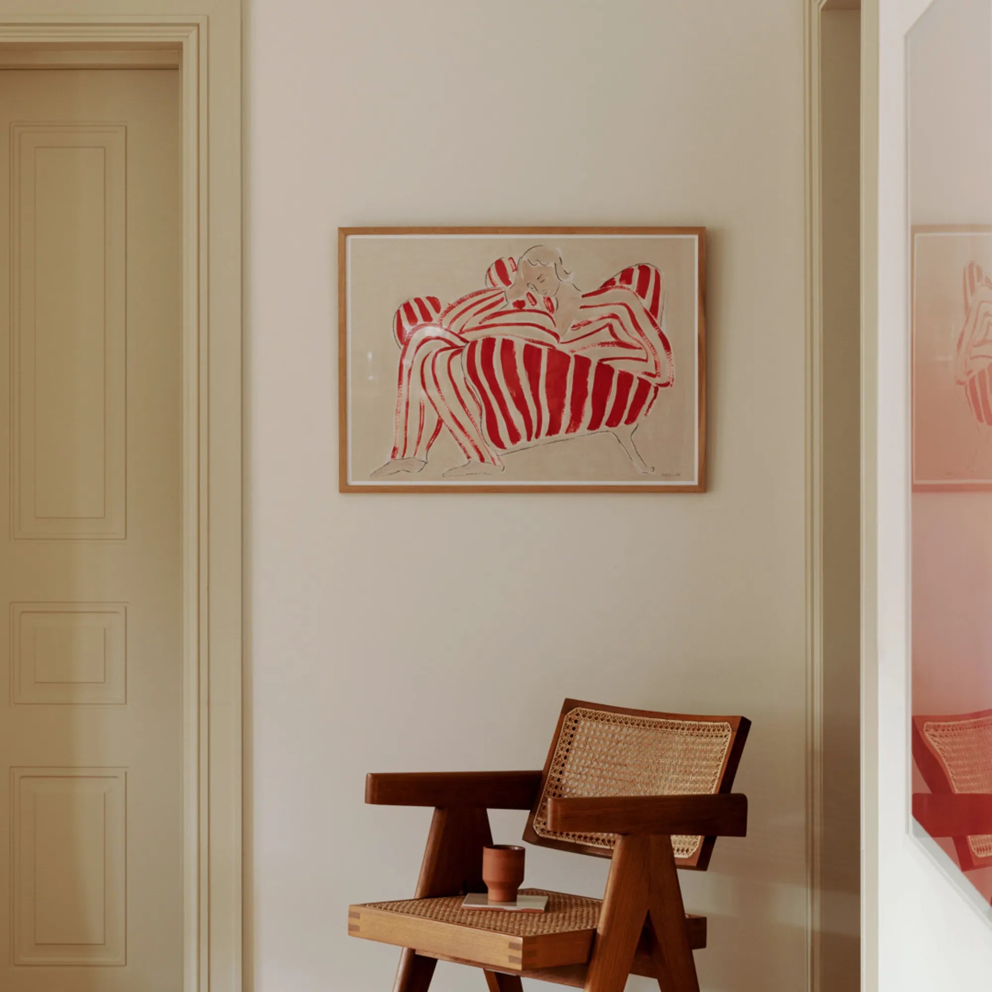  Red chair in a living room setting, adding a pop of color to the space