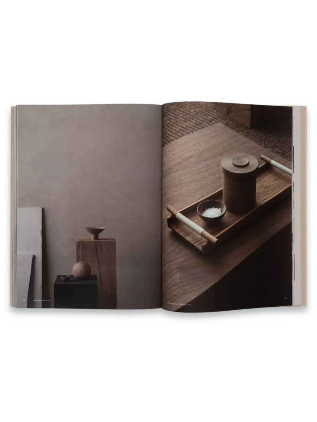 Book Soft Minimal – By Norm Architects, an open hardcover book displaying stylish interior design photography with minimalist brown and black decor. This inspirational coffee table book is ideal for architects, interior designers, and decor enthusiasts seeking modern aesthetic ideas and visual inspiration.