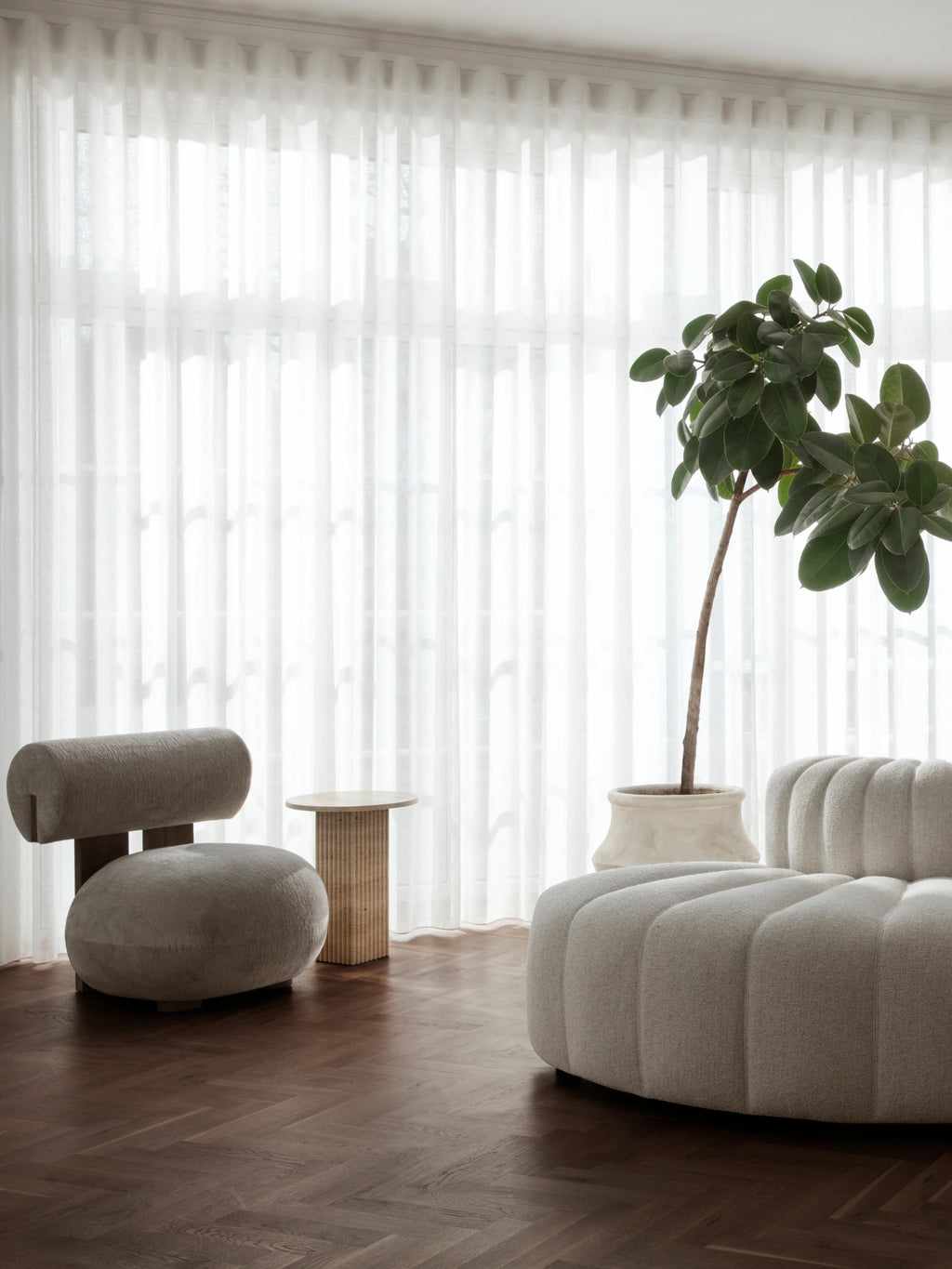 NORR11 Soho Side Table, a light natural oak wood side table featuring a distinctive fluted cylindrical base and a smooth round top, embodying an organic modern design aesthetic. This minimalist wood accent table is perfect for contemporary living rooms, bedrooms, or as a stylish sofa side table.