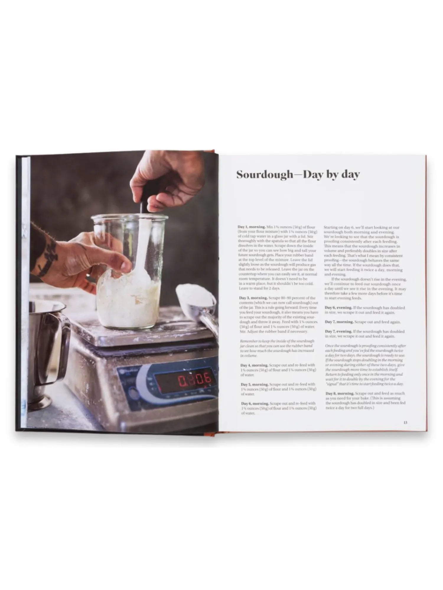 Book Sourdough for All, an open cookbook displaying a detailed recipe with vibrant photography featuring a hand mixing sourdough starter in a glass jar on a digital scale. This essential baking guide is perfect for aspiring bakers and home cooks eager to master the art of sourdough bread.
