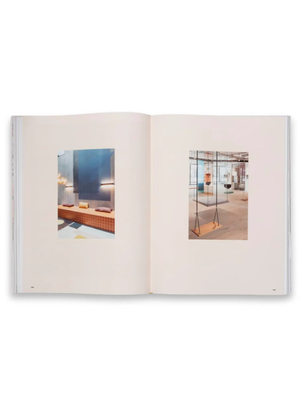 Book Spatial Storytelling, an open, premium hardcover book showcasing vibrant interior design and architectural photography. The left page features a tiled seating area with accent lighting, while the right page displays modern suspended swings in a spacious room. This inspiring book is ideal for interior designers, architects, and design enthusiasts seeking creative spatial concepts.
