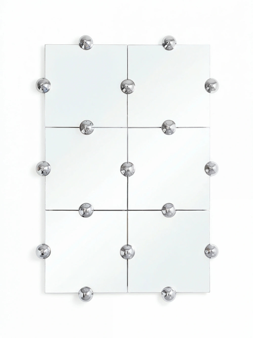Moustache Sphera Crystal Palace L Vertical Mirror, a large modular mirror composed of six square glass panels, adorned with numerous polished chrome spherical fasteners, on a white wall.