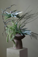 A beautiful and modern handmade ceramic fat sphere vase in white