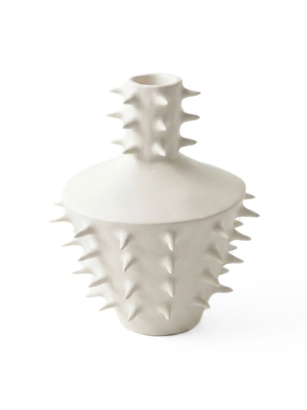 OWO Ceramics x That Cool Living Spikes Vase III, an off-white handcrafted ceramic vase featuring a distinctive sculptural design with numerous conical spikes protruding from its matte body and neck. This contemporary stoneware vase has a unique textured surface and a modern organic silhouette, resembling a stylized cactus or sea urchin. Perfect as a statement piece for modern minimalist shelf styling, brutalist interiors, or a bold centerpiece in contemporary living rooms.