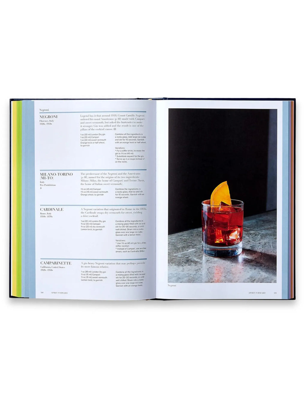 Book Spirited, an open hardcover cocktail recipe book displaying a vibrant Negroni cocktail with an orange slice alongside detailed ingredients and instructions. This premium cocktail recipe book is perfect for home mixologists and aspiring bartenders seeking classic drink knowledge.