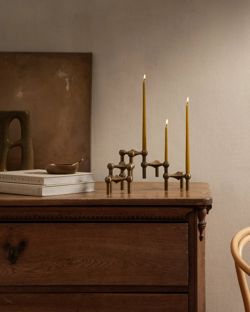 Elegant and versatile bronzed brass candle holder in a modular design
