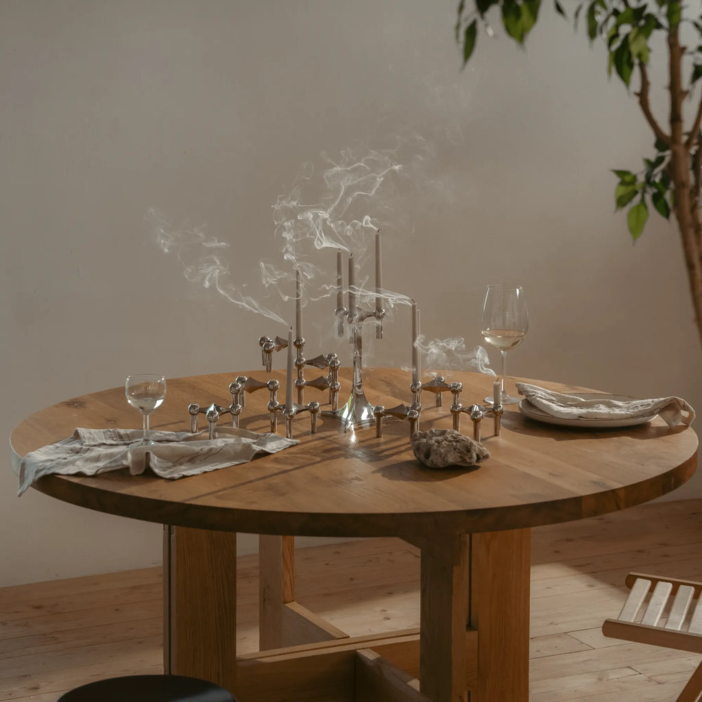 Modern candle holder in chrome with two-tier modular design