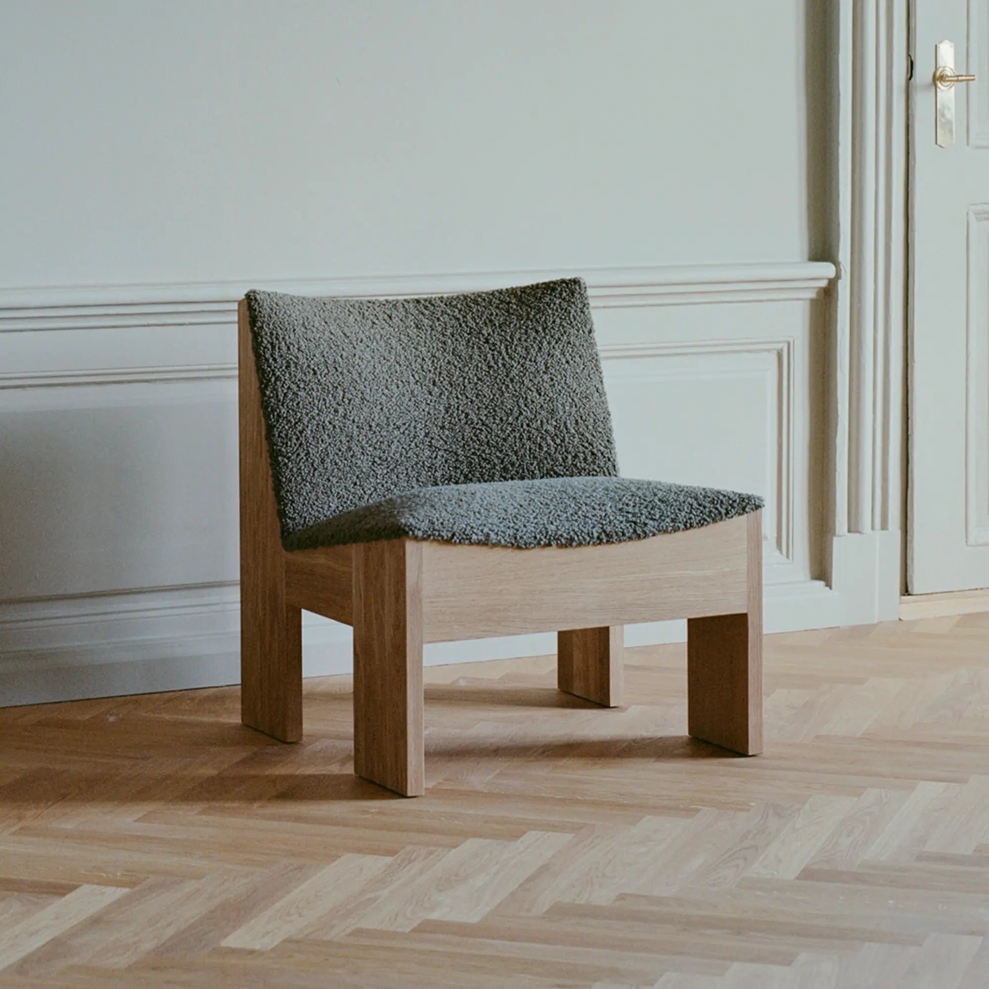  Close-up of comfortable cushioned seat on Tenon Armchair