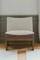  Side view of Tenon armchair showcasing its sleek and elegant design