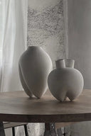 Sumo Vase with curved horns in a rustic, natural finish
