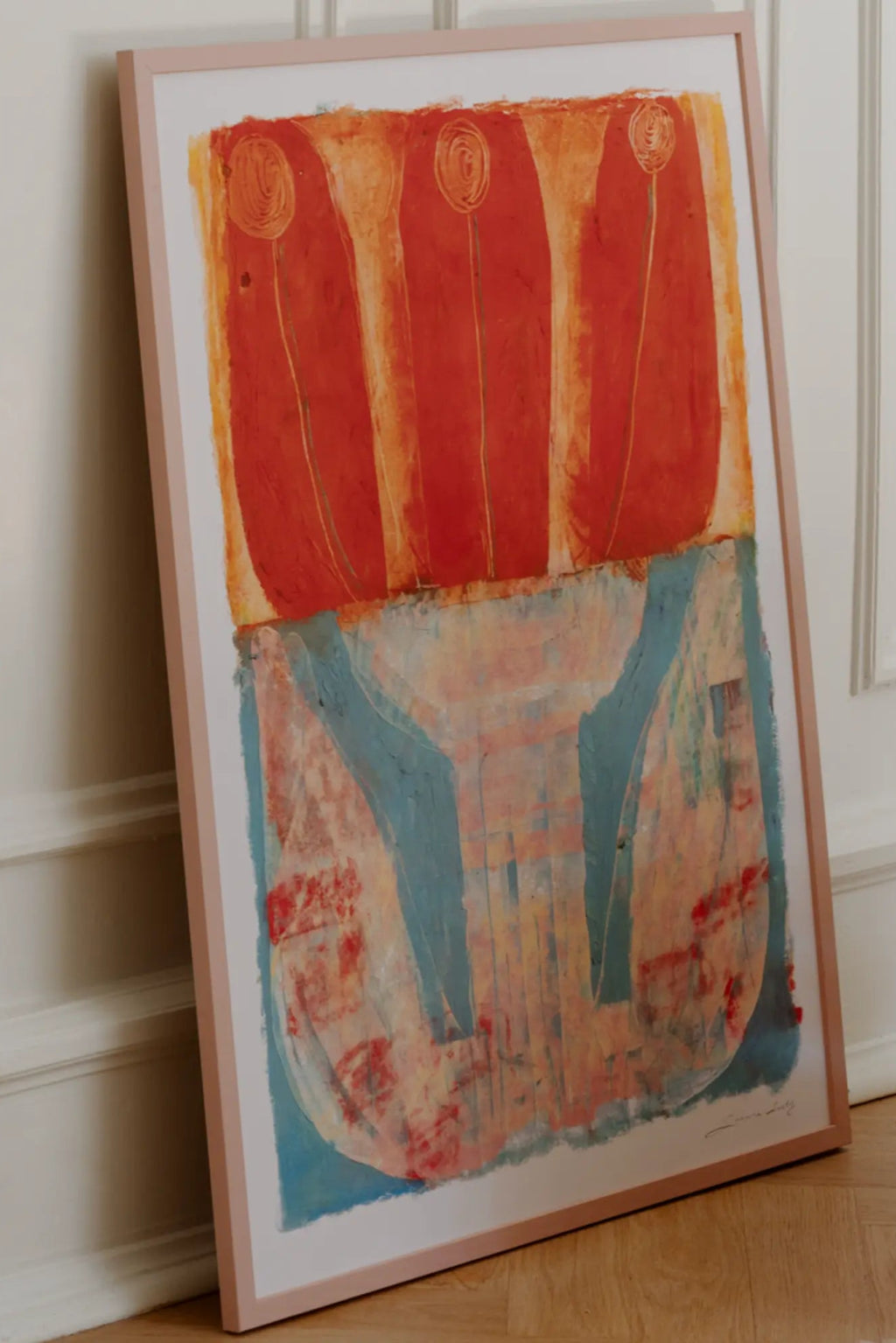 The Poster Club Radical Romantic, a vibrant abstract art print featuring bold coral and red-orange brushstrokes forming three organic shapes atop a muted teal and peach-cream base, presented in a slim, blush pink frame. This modern poster is ideal as colorful wall art for contemporary living rooms, bedrooms, or a lively addition to a gallery wall.