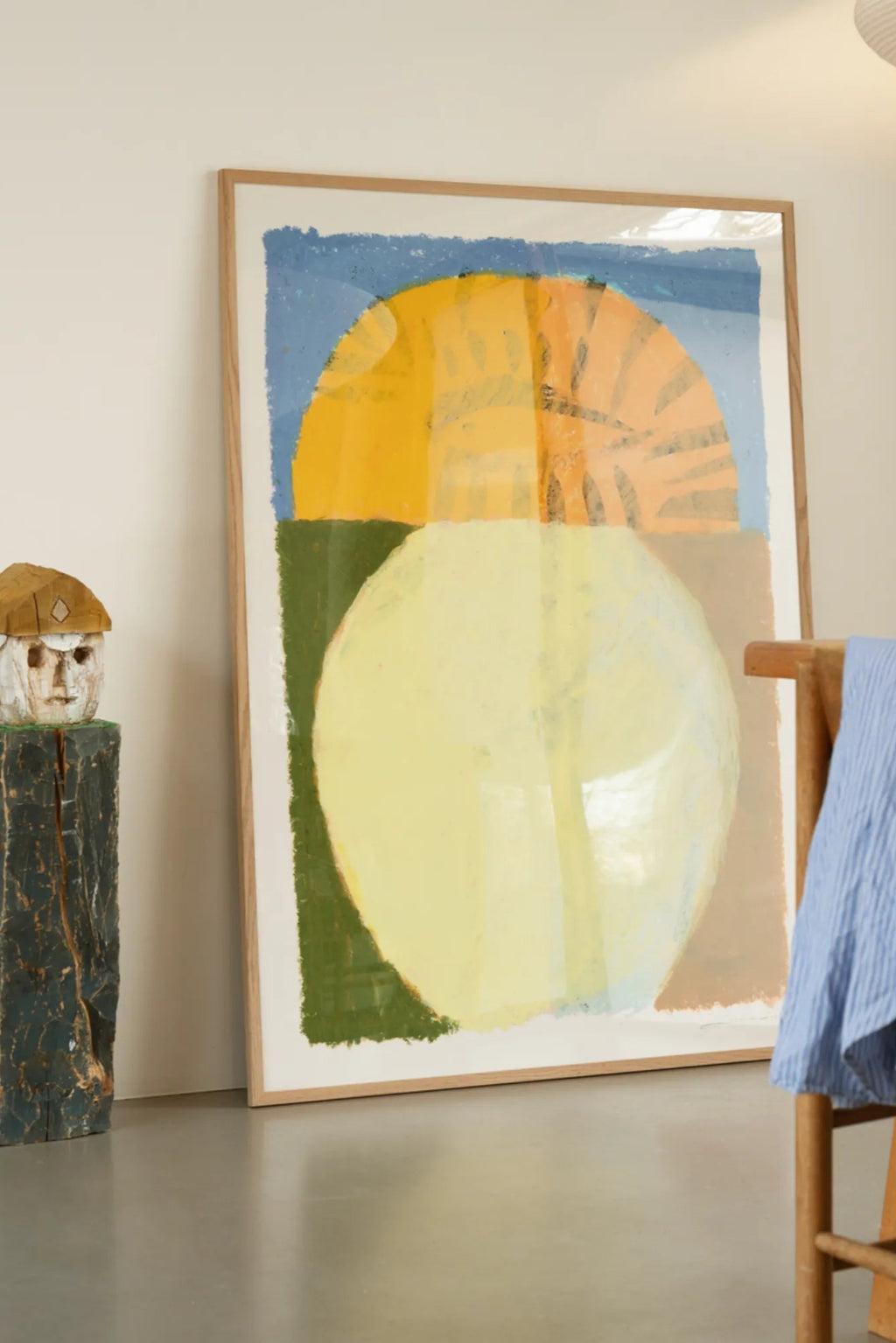 The Poster Club The Eye, a large abstract art print featuring bold organic shapes in a vibrant color palette of royal blue, sunny yellow, soft pale yellow, and dark olive green, presented in a.
