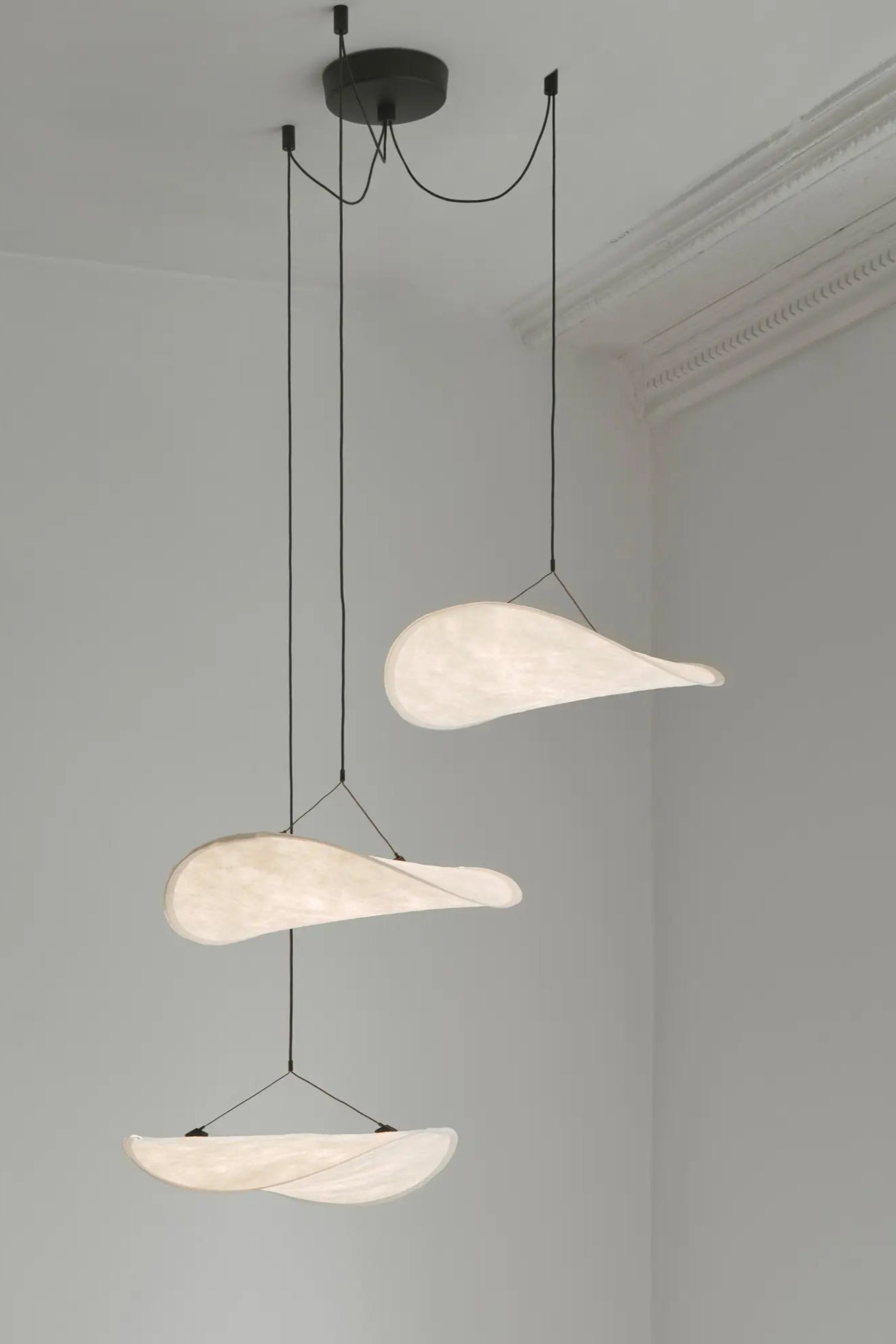 Tense Chandelier - Ø55 hanging above a grand staircase